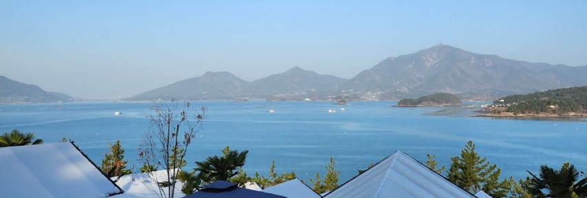 a view of a body of water and mountains